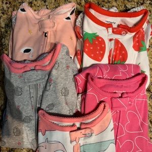 5 girls’ cotton footed pajamas by Carters.